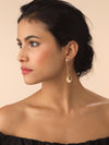 Model wearing gold moon earrings with diamond stud detailing