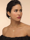 Model wearing pirate gold earring with sun talisman.