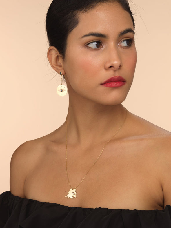 Model wearing gold Lupa necklace