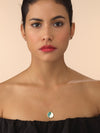 Model wearing gold yin and yang necklace with enamel detailing.