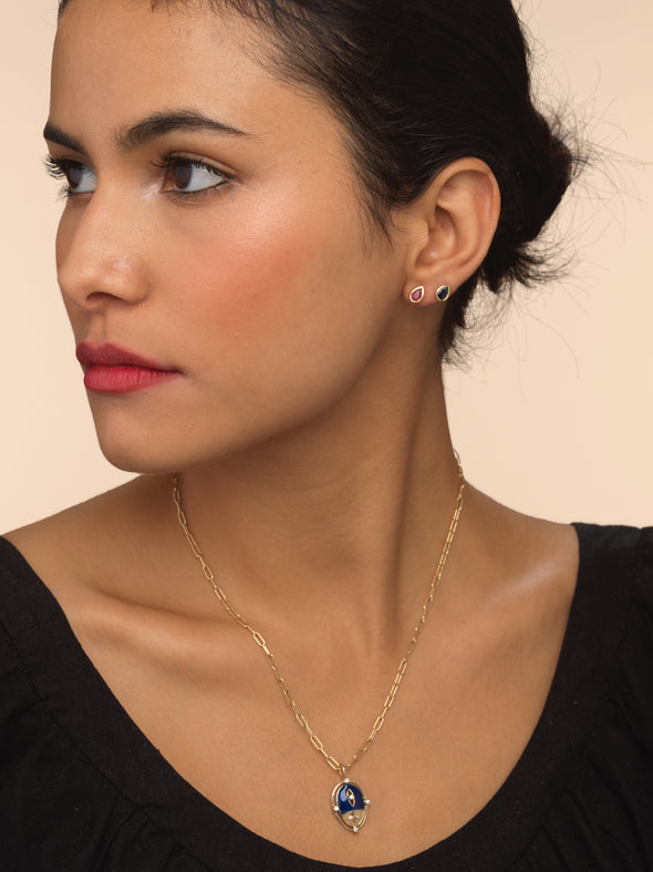 Model wearing lady luck ladybug necklace in gold and enamel.