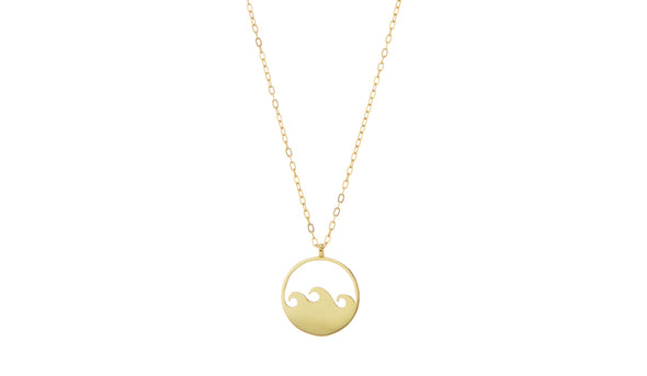 Handmade gold necklace with small wave pendant.